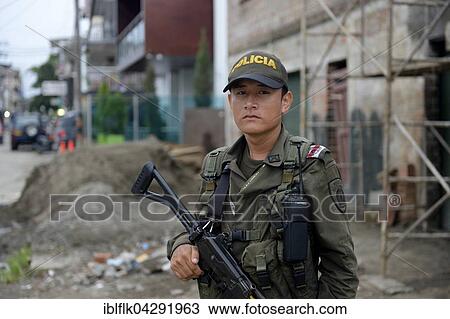Young police officer, heavily armed, guarding a road, Quibdo, Choco Department, Colombia, South America View Large Photo Image Stock Image - Young police officer, heavily armed, guarding a road, Quibdo, Choco Department, Colombia, South America. Fotosearch