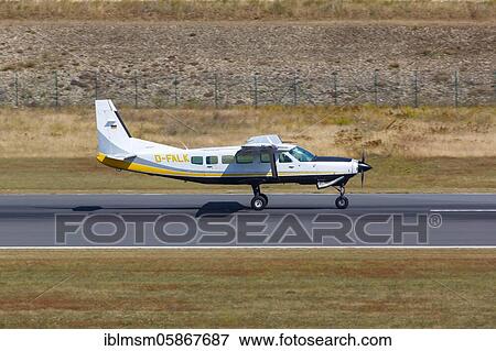 Stock Photo - A Cessna 208 Caravan I aircraft of Businesswings with the registration D-FALK at Kassel Calden Airport (KSF), Kassel, Germany, Europe. Fotosearch