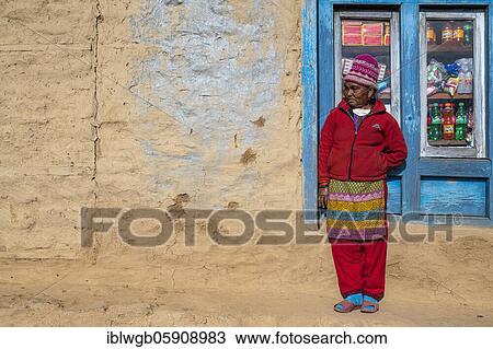 A local woman is standing in front of the window of her shop, Himalaya, Solu Khumbu, Everest region, Nepal, Asia View Large Photo Image Stock Image - A local woman is standing in front of the window of her shop, Himalaya, Solu Khumbu, Everest region, Nepal, Asia. Fotosearch