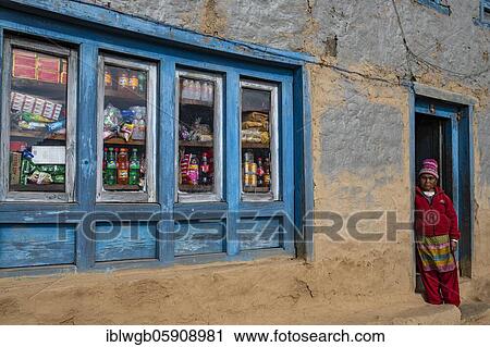 A local woman standing in the doorway of her shop, Himalayas, Solu Khumbu, Everest region, Nepal, Asia View Large Photo Image Stock Image - A local woman standing in the doorway of her shop, Himalayas, Solu Khumbu, Everest region, Nepal, Asia. Fotosearch