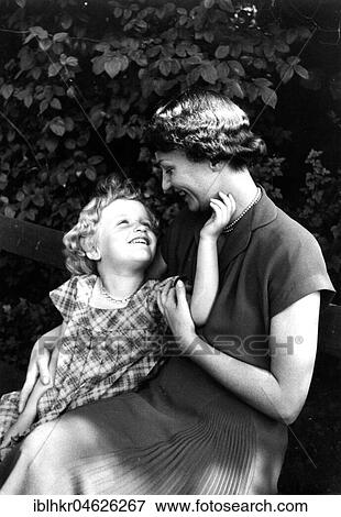 A mother is sitting on a park bench with her daughter, ca. 1955, Leipzig, Germany, Europe View Large Photo Image Stock Photo - A mother is sitting on a park bench with her daughter, ca. 1955, Leipzig, Germany, Europe. Fotosearch