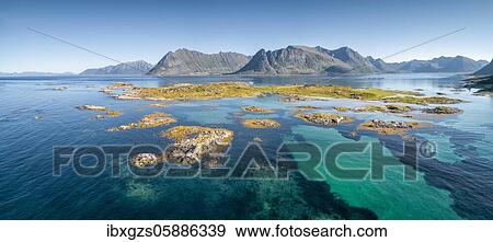 Aerial view, archipelago with grass, turquoise sea, steep mountains in the back, Lofoten, Nordland, Norway, Europe View Large Photo Image Stock Photo - Aerial view, archipelago with grass, turquoise sea, steep mountains in the back, Lofoten, Nordland, Norway, Europe. Fotosearch