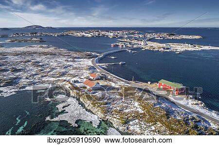 Stock Image - Aerial view, country road connecting populated, small, winterly islands in the sea, Herøy, Nordland, Norway, Europe. Fotosearch