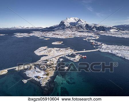 Aerial view, country road through the sea connects populated, small, winterly islands with the mainland, behind mountains, Herøy, Nordland, Norway, Europe View Large Photo Image Picture - Aerial view, country road through the sea connects populated, small, winterly islands with the mainland, behind mountains, Herøy, Nordland, Norway, Europe. Fotosearch