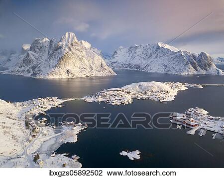 Aerial view, fishing village Reine in winter at dawn, snowy landscape, Reinefjord, Moskenesøya, Nordland, Lofoten, Norway, Europe View Large Photo Image Stock Image - Aerial view, fishing village Reine in winter at dawn, snowy landscape, Reinefjord, Moskenesøya, Nordland, Lofoten, Norway, Europe. Fotosearch