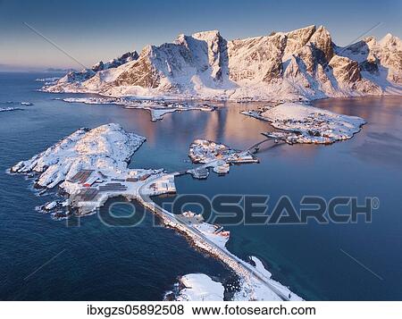 Aerial view, fjord landscape at sunrise, snowy mountains in winter, fishing village Reine, Nordland, Lofoten, Norway, Europe View Large Photo Image Stock Photo - Aerial view, fjord landscape at sunrise, snowy mountains in winter, fishing village Reine, Nordland, Lofoten, Norway, Europe. Fotosearch