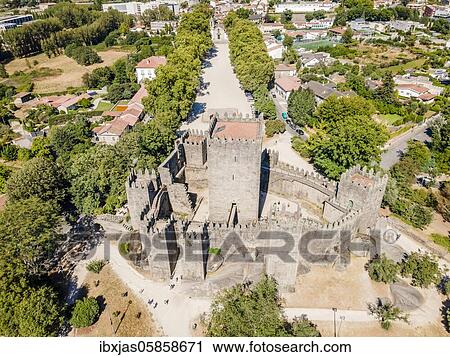 Stock Image - Aerial view of castle of Guimaraes, first capital of Portugal. Fotosearch
