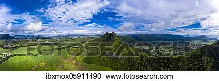 Stock Image - Aerial view of Mont du Rempart with Trois Mamelles, sugar cane fields, Black River region, Mauritius, Africa. Fotosearch