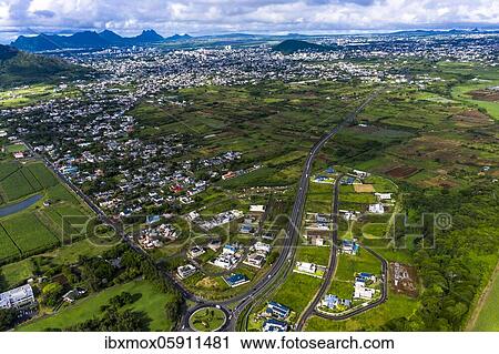 Stock Image - Aerial view of the Mountain Corps de Grande, sugar cane fields, Black River region, behind the towns of Vacoas-Phönix and Quatre Bornes, Mauritius, Africa. Fotosearch