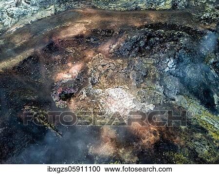 Stock Image - Aerial view Steaming crater with colorful rocks in the Krafla lava field, Skútustaðir, Norðurland eystra, Iceland, Europe. Fotosearch