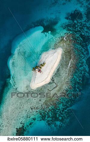 Aerial view, tropical island with palm trees and huts, San Blas Islands, Panama, Central America View Large Photo Image Stock Image - Aerial view, tropical island with palm trees and huts, San Blas Islands, Panama, Central America. Fotosearch