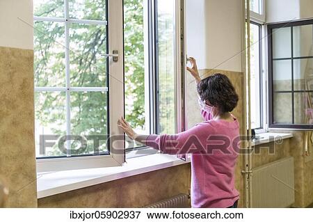 Airing in a classroom, Teacher opens window to air, Austria, Europe View Large Photo Image Stock Photo - Airing in a classroom, Teacher opens window to air, Austria, Europe. Fotosearch
