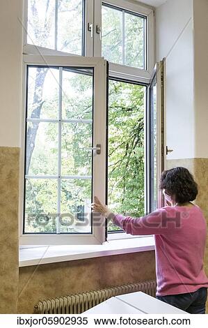 Airing in a classroom, Teacher opens window to air, Austria, Europe View Large Photo Image Stock Photography - Airing in a classroom, Teacher opens window to air, Austria, Europe. Fotosearch