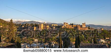 Stock Photography - Alhambra on the Sabikah hill at sunset, Moorish citadel, Nasrid palaces, Palace of Charles the Fifth, behind Sierra Nevada with snow, Granada, Andalucia, Spain, Europe. Fotosearch