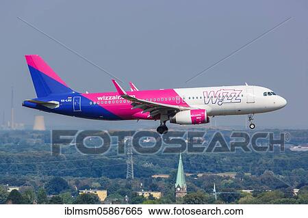 Stock Photography - An Airbus A320 aircraft of Wizzair with the registration HA-LWU at Dortmund Airport (DTM), Dortmund, Germany, Europe. Fotosearch