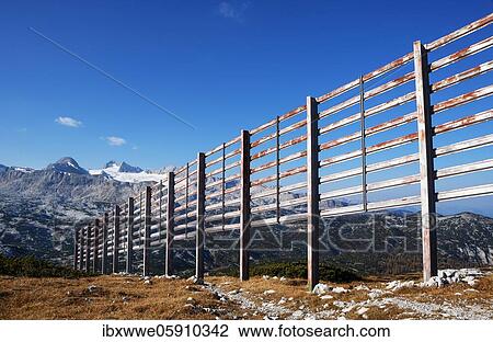 Avalanche barrier with view to the Hoher Dachstein, Dachstein massif, Krippenstein, Obertraun, Salzkammergut, Upper Austria, Austria, Europe View Large Photo Image Stock Image - Avalanche barrier with view to the Hoher Dachstein, Dachstein massif, Krippenstein, Obertraun, Salzkammergut, Upper Austria, Austria, Europe. Fotosearch