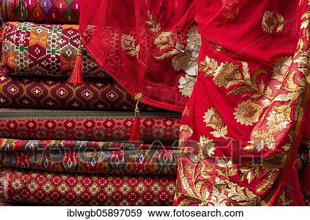 Stock Photo - Bales of cloth and sartoids are offered for sale, Bhaktapur, Kathmandu, Nepal, Asia. Fotosearch