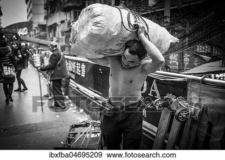 Bang-bang carriers in a market at the port of Chongqing, the carriers are like a caste of their own, carrying loads for the traders for little money, mostly immigrant workers from rural areas, Chongqing, China, Asia View Large Photo Image Stock Photo - Bang-bang carriers in a market at the port of Chongqing, the carriers are like a caste of their own, carrying loads for the traders for little money, mostly immigrant workers from rural areas, Chongqing, China, Asia. Fotosearch