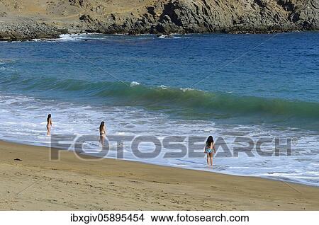 Bathers at the beach of Quebrada de la Huaca, also Puerto Inca, Chala, Arequipa region, Peru, South America View Large Photo Image Picture - Bathers at the beach of Quebrada de la Huaca, also Puerto Inca, Chala, Arequipa region, Peru, South America. Fotosearch