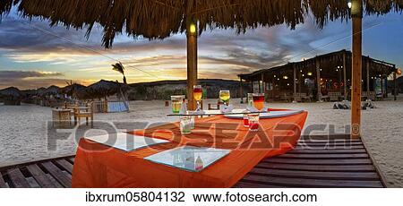Beach bar with different cocktails at sunset at the coral reef Abu-Dabbab, Hilton Nubian Resort, Al Qusair, Marsa Alam, Egypt, Africa View Large Photo Image Stock Image - Beach bar with different cocktails at sunset at the coral reef Abu-Dabbab, Hilton Nubian Resort, Al Qusair, Marsa Alam, Egypt, Africa. Fotosearch