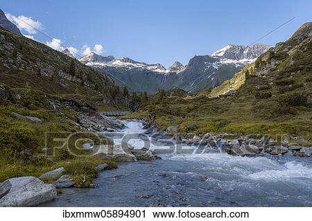 Stock Image - Bergbach, Zemmbach, in the back Little Mörchner and Zsigmondyspitze, snow-covered mountains, Berliner Höhenweg, Zillertaler Alps, Zillertal, Tyrol, Austria, Europe. Fotosearch