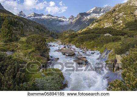 Stock Photography - Bergbach, Zemmbach, in the back Little Mörchner and Zsigmondyspitze, snow-covered mountains, Berliner Höhenweg, Zillertaler Alps, Zillertal, Tyrol, Austria, Europe. Fotosearch