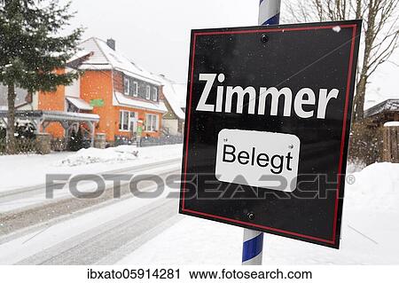 Black sign with the inscription Zimmer belegt, dreary winter weather, district Schierke, Wernigerode, Harz County, Saxony-Anhalt, Germany, Europe View Large Photo Image Stock Image - Black sign with the inscription Zimmer belegt, dreary winter weather, district Schierke, Wernigerode, Harz County, Saxony-Anhalt, Germany, Europe. Fotosearch