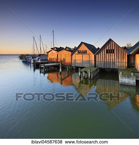 Boat houses in the harbour at Saaler Bodden, morning light, Althagen, Ahrenshoop, Fischland-Darß-Zingst, Mecklenburg-Western Pomerania, Germany, Europe View Large Photo Image Stock Photo - Boat houses in the harbour at Saaler Bodden, morning light, Althagen, Ahrenshoop, Fischland-Darß-Zingst, Mecklenburg-Western Pomerania, Germany, Europe. Fotosearch
