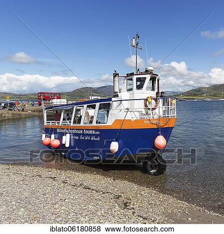 Stock Photo - Boat with wheels, amphibious vehicle with tourists, Knightstown, Valentia Island, coastal road Skellig Ring, Iveragh Peninsula, Wild Atlantic Way, Ireland, Europe. Fotosearch