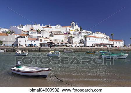 Boats in front of the fishing village of Ferragudo, near Portimao, Algarve, Portugal, Europe View Large Photo Image Stock Image - Boats in front of the fishing village of Ferragudo, near Portimao, Algarve, Portugal, Europe. Fotosearch