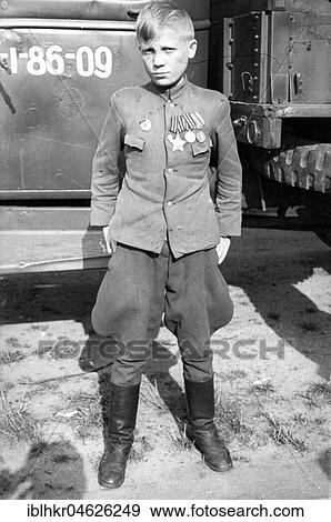 Stock Photo - Boy with uniform and medal, ca. 1945, Leipzig, Germany, Europe. Fotosearch