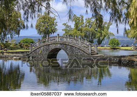 Bridge with reflection, Liliuokalani Park and Gardens, Hilo, Big Island, Hawaii View Large Photo Image Stock Photo - Bridge with reflection, Liliuokalani Park and Gardens, Hilo, Big Island, Hawaii. Fotosearch