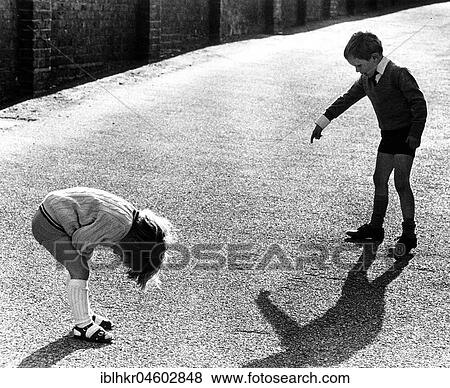 Stock Photo - Brother and sister play together, England, Great Britain. Fotosearch