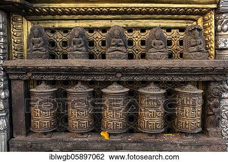 Stock Image - Buddhist prayer wheels at Swayambhunath Stupa, Kathmandu, Nepal, Asia. Fotosearch