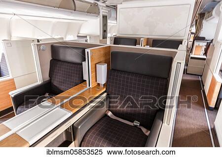 Stock Photography - Business Class cabin of an Airbus A340-300 aircraft of Swiss at Zurich Airport (ZRH) in the, Zurich, Switzerland, Europe. Fotosearch