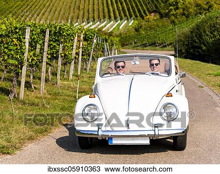 Businessmen in a classic car, driving through vineyards, Remstal, Baden-Württemberg, Germany, Europe View Large Photo Image Stock Image - Businessmen in a classic car, driving through vineyards, Remstal, Baden-Württemberg, Germany, Europe. Fotosearch