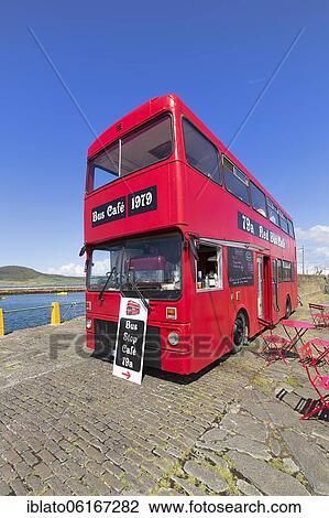 Stock Image - Café in a red double-decker bus, Bus Stop Café, Knightstown, Valentia Island, Coastal road Skellig Ring, Iveragh Peninsula, Wild Atlantic Way, Ireland, Europe. Fotosearch