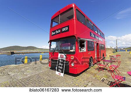 Stock Image - Café in a red double-decker bus, Bus Stop Café, Knightstown, Valentia Island, Coastal road Skellig Ring, Iveragh Peninsula, Wild Atlantic Way, Ireland, Europe. Fotosearch
