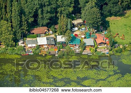Camping Die Wild, Wildlife trail, Summer cottages by the water, Emmerich, Lower Rhine, North Rhine-Westphalia, Germany, Europe View Large Photo Image Stock Photo - Camping Die Wild, Wildlife trail, Summer cottages by the water, Emmerich, Lower Rhine, North Rhine-Westphalia, Germany, Europe. Fotosearch
