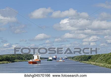 Stock Photograph - Cargo ships on the Kiel Canal, Schleswig-Holstein, Germany, Europe. Fotosearch