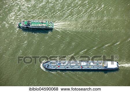 Cargo ships on the Rhine, inland waterway transport, Rheinauen, Rees, Lower Rhine, Rhine, North Rhine-Westphalia, Germany, Europe View Large Photo Image Stock Photo - Cargo ships on the Rhine, inland waterway transport, Rheinauen, Rees, Lower Rhine, Rhine, North Rhine-Westphalia, Germany, Europe. Fotosearch