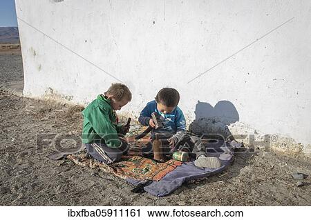 Children of a nomadic family in the Altai mountains, Olgii province, Mongolia, Asia View Large Photo Image Stock Image - Children of a nomadic family in the Altai mountains, Olgii province, Mongolia, Asia. Fotosearch