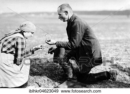 Stock Photo - Christian custom, crosses are blessed with holy water, ca. 1930, exact place unknown, Germany, Europe. Fotosearch