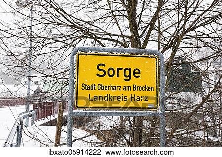 Stock Image - City limit sign Sorge, dreary winter weather, district Sorge, Oberharz am Brocken, district Harz, Saxony-Anhalt, Germany, Europe. Fotosearch