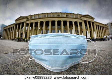 Stock Photograph - City of Stuttgart exceeds important corona mark, 7-day incidence, discarded face mask lies on the floor, Königsbau, corona crisis, Stuttgart, Baden-Württemberg, Germany, Europe. Fotosearch