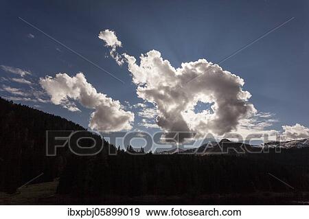 Cloud formation, behind it the sun, Obernberger See, Tyrol, Austria, Europe View Large Photo Image Stock Photo - Cloud formation, behind it the sun, Obernberger See, Tyrol, Austria, Europe. Fotosearch