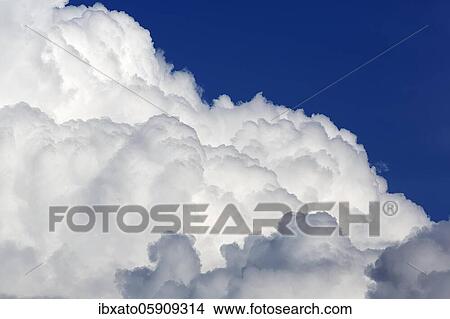 Cloud formation, white and grey cumulus clouds, cumulus clouds in front of a blue sky, background image, North Rhine-Westphalia, Germany, Europe View Large Photo Image Picture - Cloud formation, white and grey cumulus clouds, cumulus clouds in front of a blue sky, background image, North Rhine-Westphalia, Germany, Europe. Fotosearch