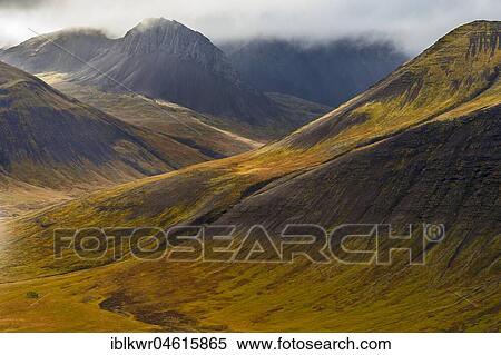 Cloudy atmosphere in front of mountains in autumn colours, Westfjords, Iceland, Europe View Large Photo Image Stock Photography - Cloudy atmosphere in front of mountains in autumn colours, Westfjords, Iceland, Europe. Fotosearch