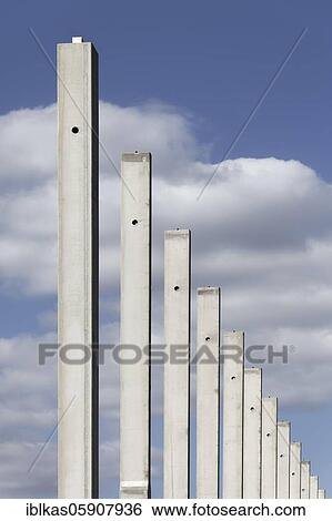 Concrete columns in a row, in front of a blue sky, carcass logistics hall, Duisburg, North Rhine-Westphalia, Germany, Europe View Large Photo Image Stock Photograph - Concrete columns in a row, in front of a blue sky, carcass logistics hall, Duisburg, North Rhine-Westphalia, Germany, Europe. Fotosearch