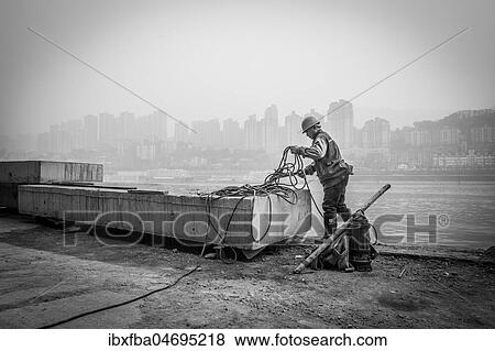 Stock Photo - Construction workers on the banks of the Yangtze River, Chongqing Port, Chongqing, China, Asia. Fotosearch
